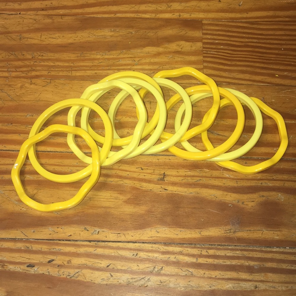 10 vintage yellow plastic bangles